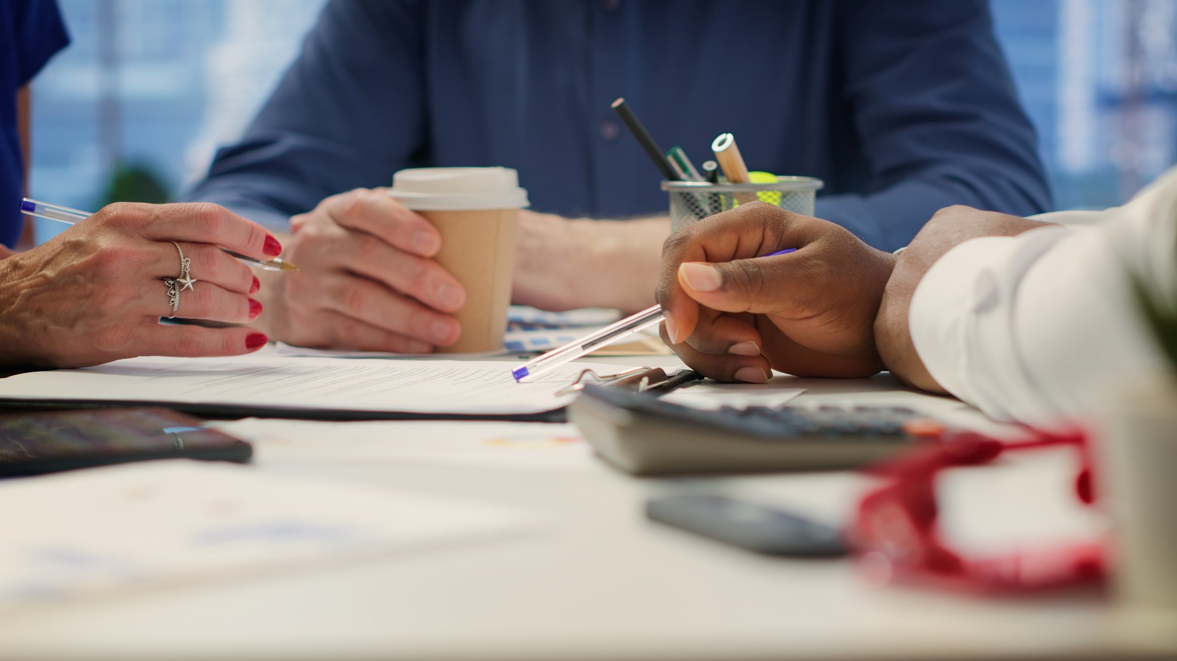 Financial advisor meeting with clients in a modern office